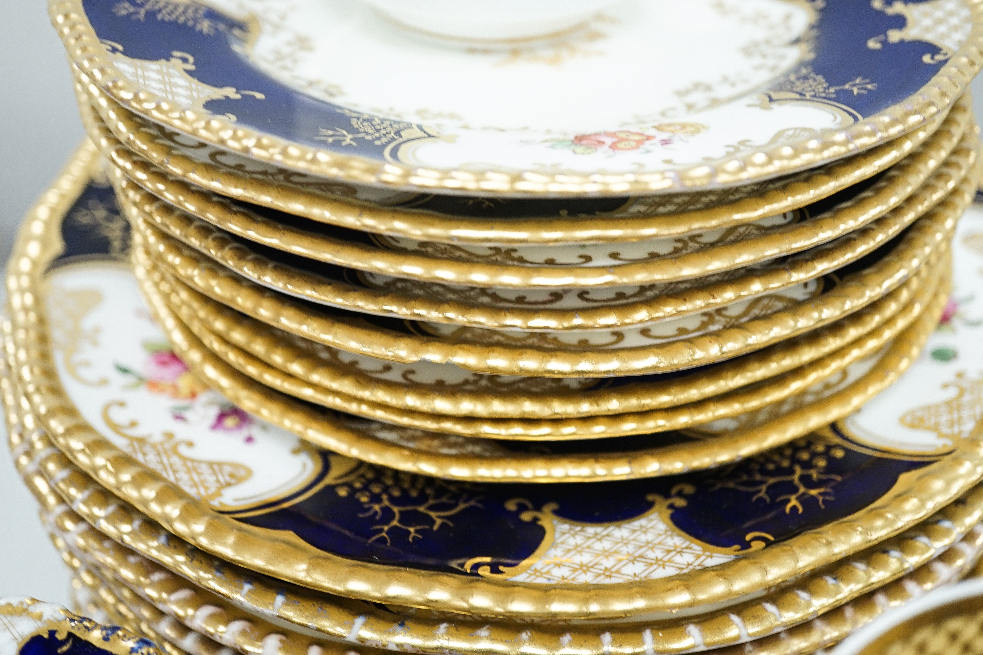 A large set of Coalport blue ground tea and coffee service and similar green ground tea wares